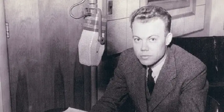 Donald Grantham sitting in front of a microphone