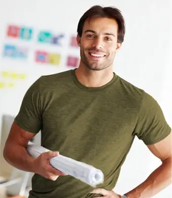 Man in shirt holding blueprints