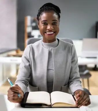 Woman sitting with a notebook