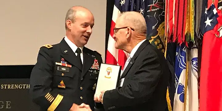 Gen. Thomas Rhame is presented the United States Army War College Outstanding Alum Award